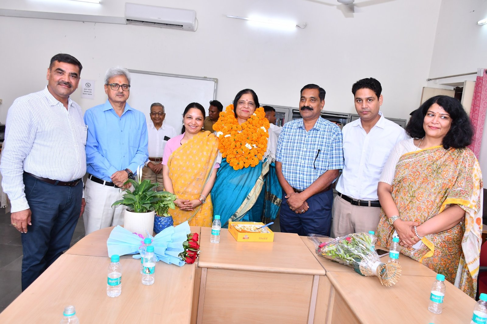 Faculty members at a felicitation event.